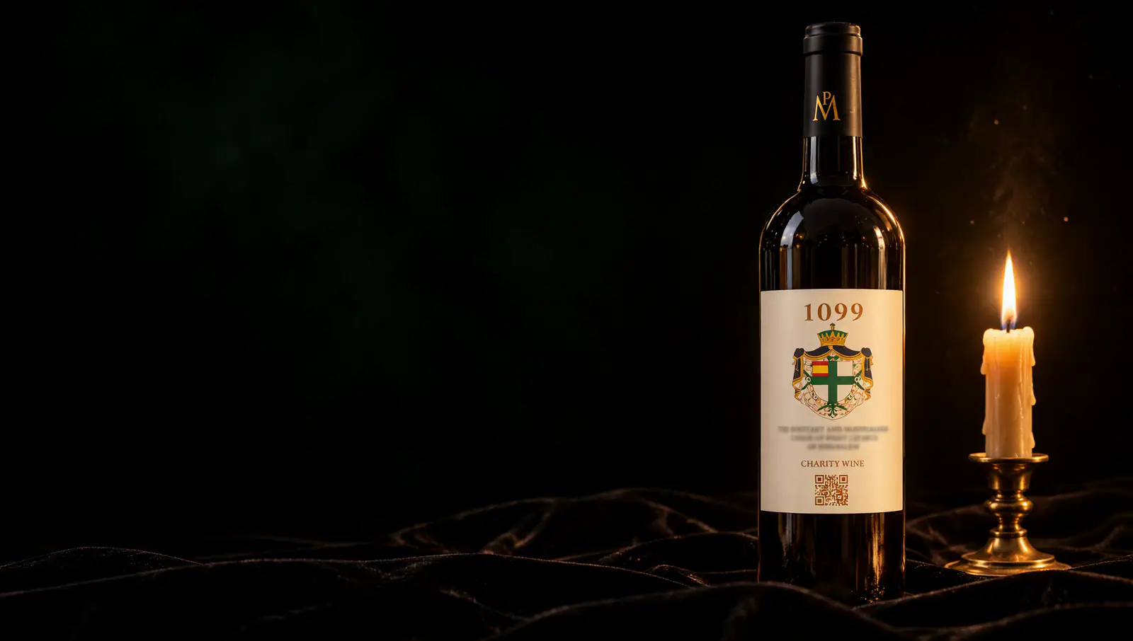 A bottle of 1099 Saint Lazarus Charity Wine beside a single candle